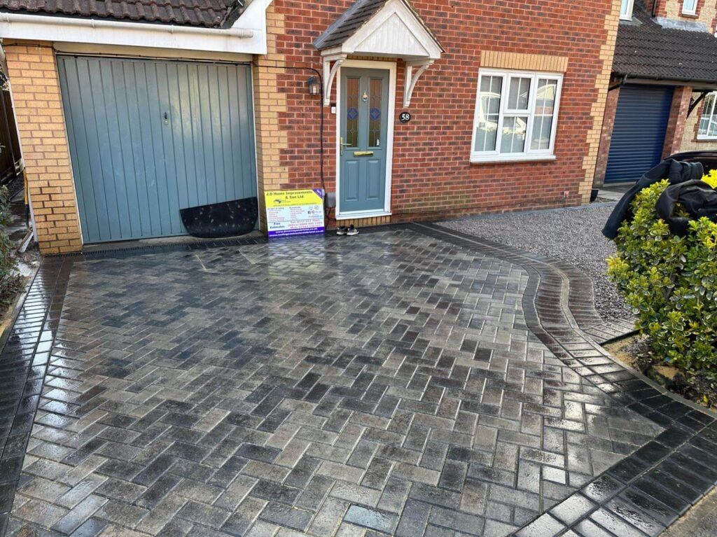 dark grey pavers installed on a driveway